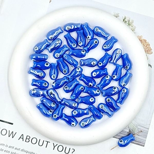 Blue fish-shaped ceramic beads with evil eye design for DIY jewelry making