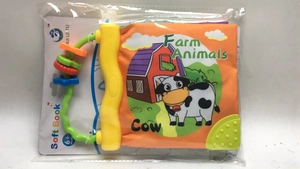 Close-up of farm animals baby cloth book with teething toy and bead handle for sensory play