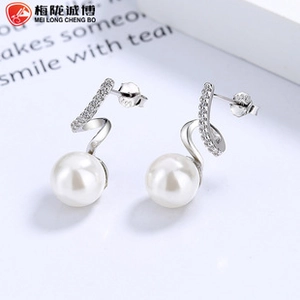 Macro detail of S925 silver wave earrings featuring micro-set zircons and round white pearls