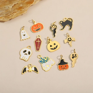 Handmade Halloween charms collection with pumpkins and ghosts on light background