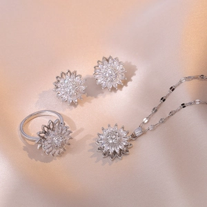 Exquisite sunflower jewelry set with sparkling crystals on champagne silk fabric background