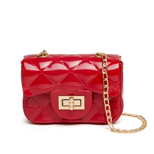 Mini red quilted jelly bag with gold chain strap and metallic turn-lock closure