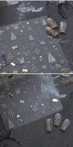 Detail of M-235 gold metallic Christmas nail stickers with snowflakes and stars