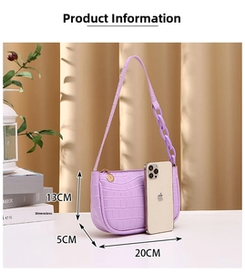 Detailed size comparison of purple crocodile pattern hobo bag with smartphone