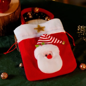 Christmas knitted drawstring gift bag with plush Santa Claus and star on festive green velvet