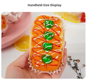 Macro shot of a slow-rebound bread squeeze toy with heart garnish and frosting