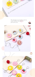 Detail showing dual inch and cm scale on cute cartoon mini retractable measuring tape