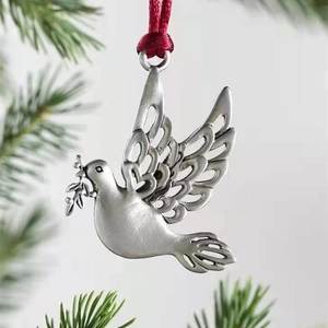 Silver metal peace dove Christmas ornament with olive branch and red ribbon hanging
