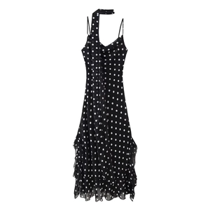 Polka dot camisole maxi dress with halter ties and ruffled hem on white background