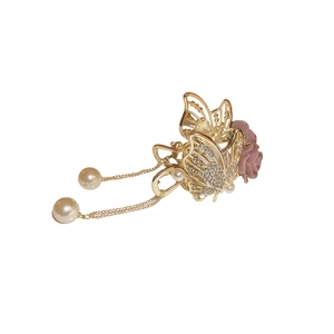 Elegant gold butterfly hair claw with sparkling rhinestones, pink flowers and pearl tassel