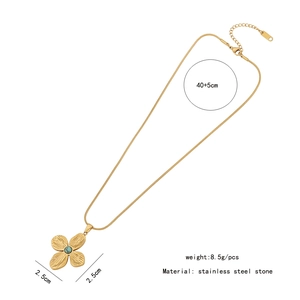 Detailed view of golden flower pendant with turquoise stone and chain measurements