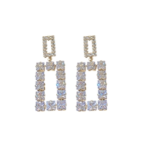 Elegant gold hollow square drop earrings with sparkling cubic zirconia on white background
