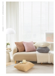 Detailed macro view of 3D bubble textured cushion covers in five assorted cozy colors