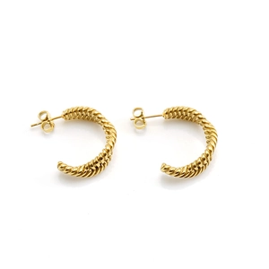 Close-up of 18K gold plated C-shaped twisted hoop earrings with elegant texture
