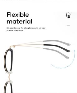 Detail of flexible black and gold glasses frame showing temple elasticity and comfort