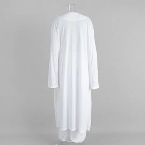 Detailed back view of white longline cardigan and loose lantern pants set in soft linen