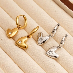 Polished stainless steel heart drop earrings with starburst crystal in gold and silver