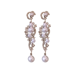 Elegant long drop earrings with white faux pearls and sparkling rhinestones in silver finish