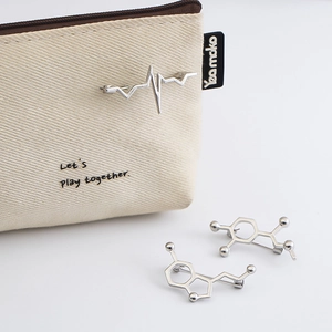 Scientific silver molecule and heartbeat pins set with a canvas storage pouch
