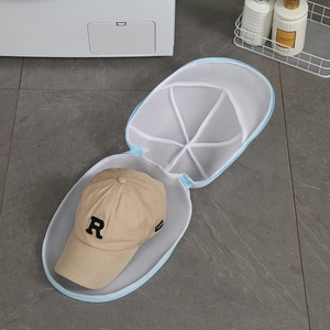 Detail of mesh hat laundry bag showing interior support frame and zipper closure