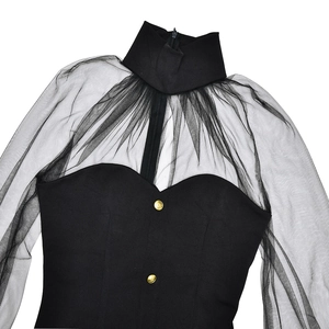Detailed shot of black mesh patchwork dress with standing collar and gold buttons