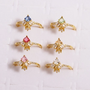 Detail showing various colors of boho rings with diamond-shaped stones and zircons