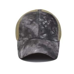 Close-up of tie-dye front and breathable mesh back on this criss-cross ponytail baseball cap
