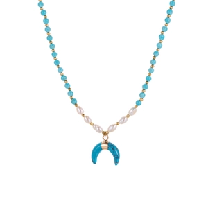 Detail of bohemian necklace with turquoise beads, baroque pearls and moon pendant