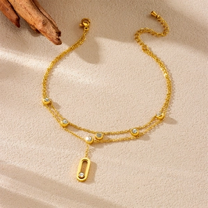 Elegant gold double-layered stainless steel anklet with diamond accents and oval pendant