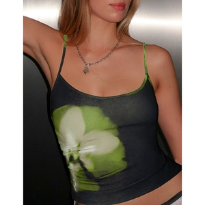 Close-up of slim-fit black camisole featuring a vibrant green floral orchid print