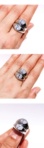 Detailed view of silver double-layered ring with oval cubic zirconia stones