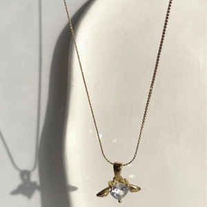 Elegant gold bee pendant necklace with heart-shaped crystal and fine link chain for women