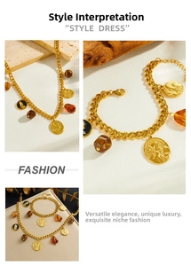 Detail of vintage gold plated coin pendant and brown resin beads on stainless steel chain