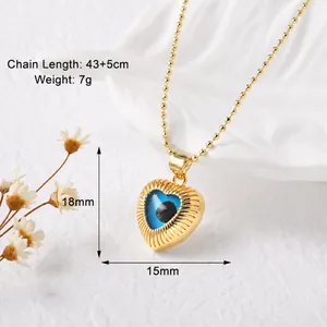 Detail of evil eye heart pendant with 43+5cm gold ball chain showing weight and dimensions