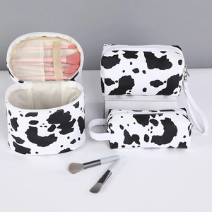 3-piece cow print PU leather makeup bag set with brushes storage and handle