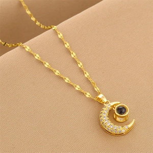 Golden titanium moon necklace with full zircon inlay and I Love You projection stone