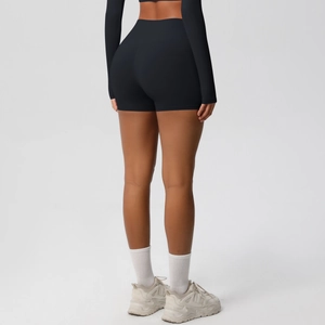 Rear view of high-waisted black yoga shorts featuring butt-lifting design and matte fabric