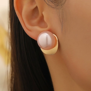 Exaggerated oversized pink pearl stud earring with golden geometric metal base for women