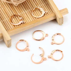 Rose gold stainless steel earring hooks with loop on bamboo tray for DIY jewelry