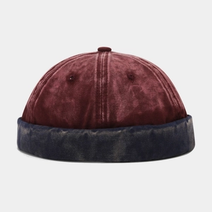 Detail of vintage washed docker hat with burgundy top and navy blue brim patchwork