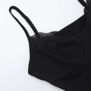 Detailed close-up of delicate lace trim and fine straps on this black lace bodysuit