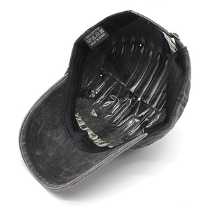 Detail view of washed cotton baseball cap interior with quality stitching and 100% cotton label