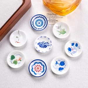 Set of 8 miniature blue and white porcelain plates with traditional Chinese patterns