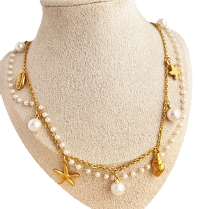 Double layer gold stainless steel necklace with pearls, starfish, and seashell pendants