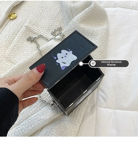 Internal structure of black chain crossbody bag with cartoon ghost print and silver chain
