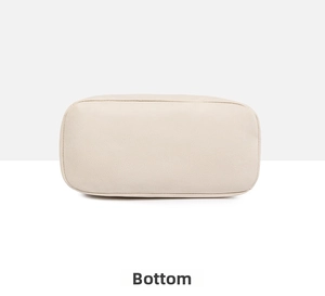 Detailed bottom view of the off-white PU leather backpack showing fine stitching and texture