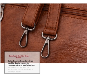 Detail of durable gunmetal detachable hooks and lychee pattern leather shoulder strap