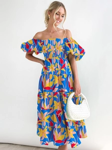 Detail of off-shoulder floral dress with puff sleeves and layered skirt in blue