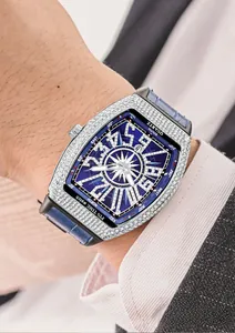 Close-up of diamond-studded tonneau watch with blue dial and leather strap on wrist