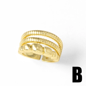 Polished 18k gold plated multi-layer ring featuring wave texture and delicate chain design